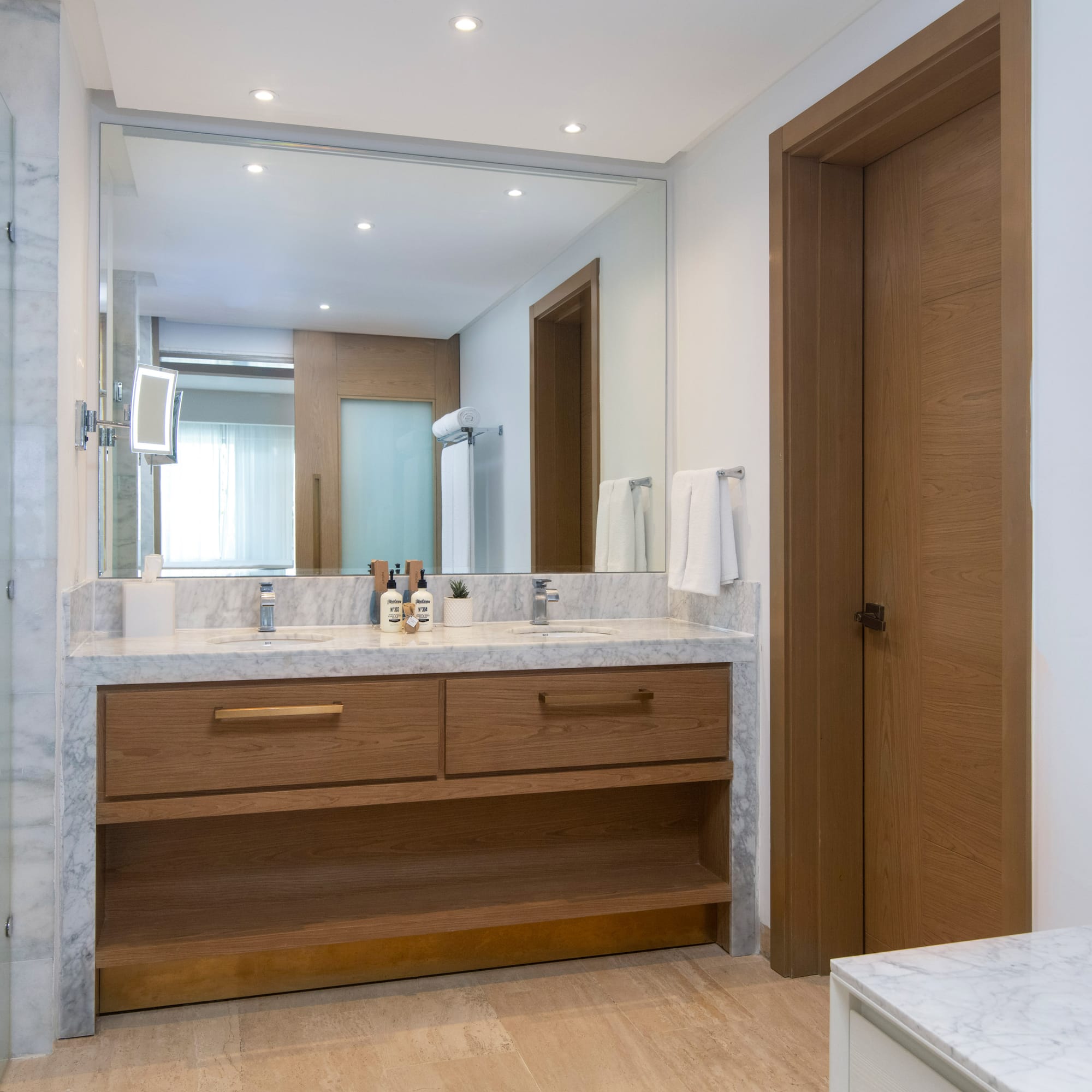 a bathroom with a marble countertop and a door