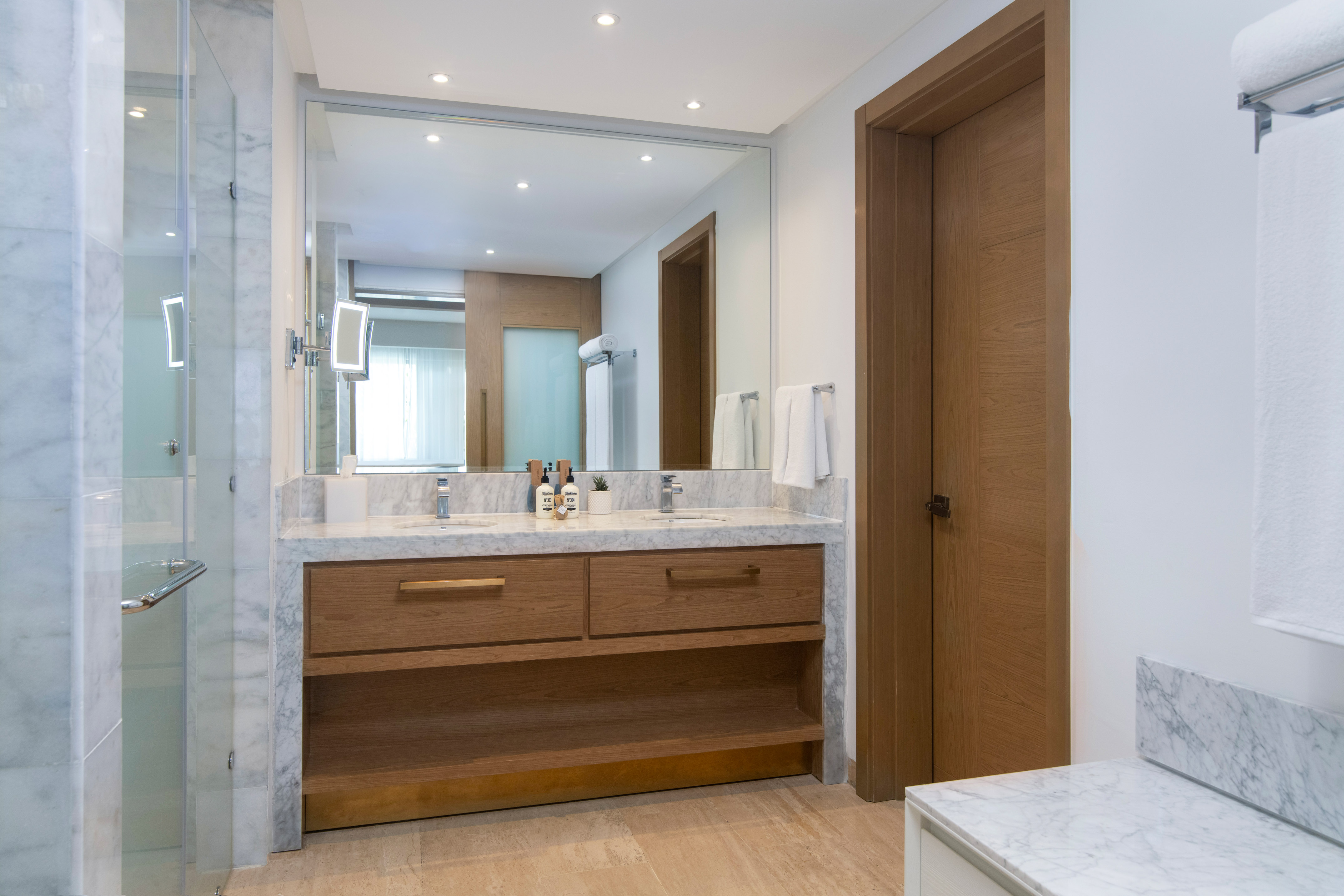a bathroom with a marble countertop and a door