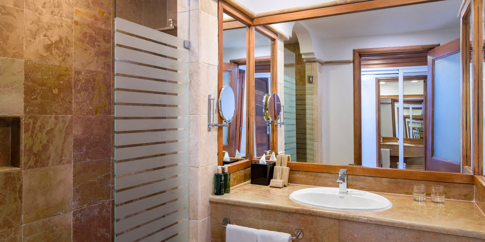 a bathroom with a mirror and sink