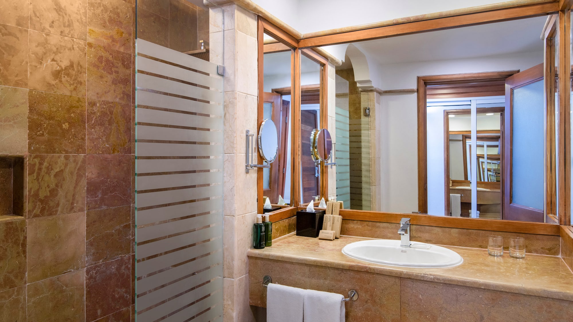 a bathroom with a mirror and sink