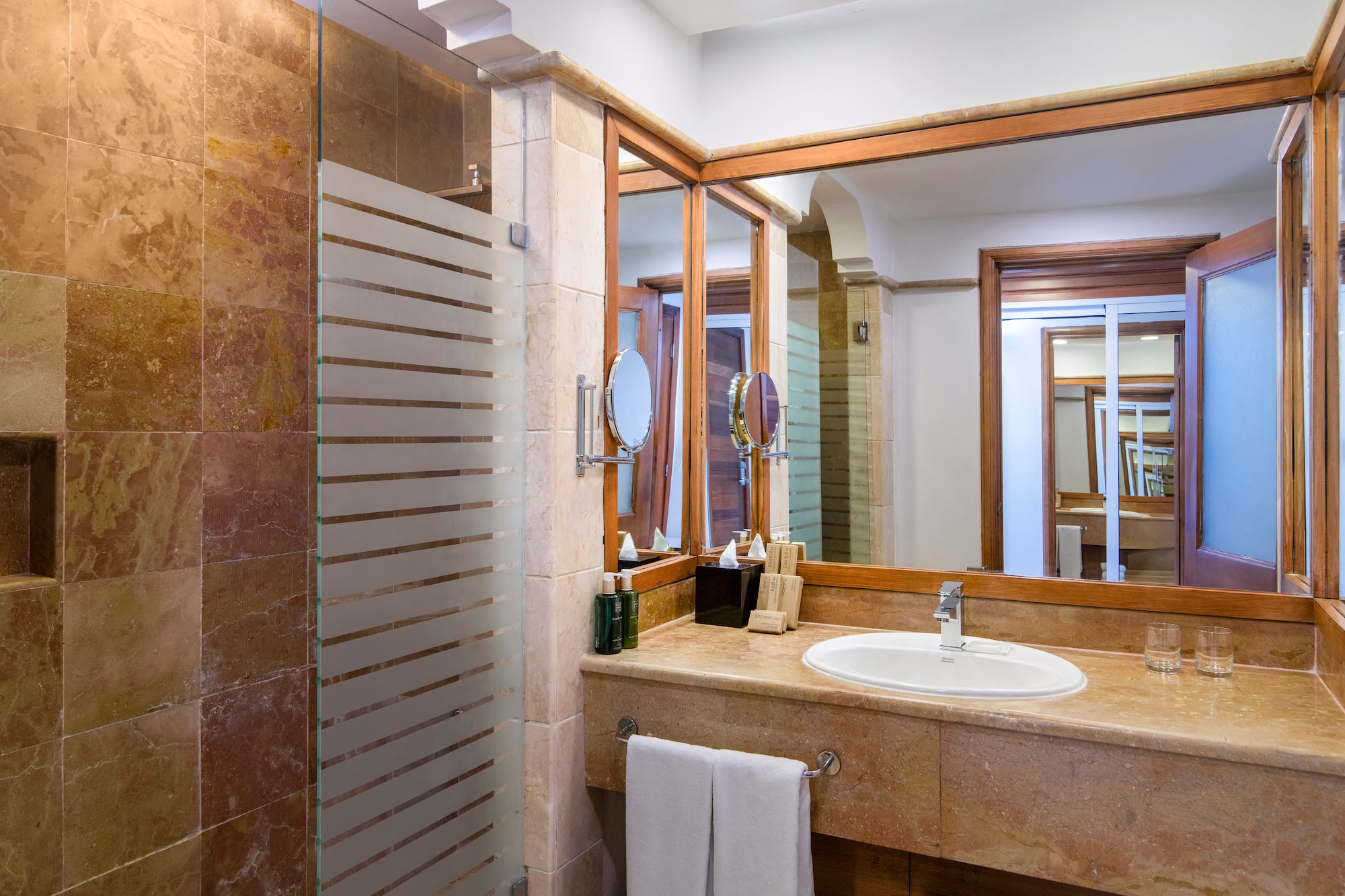 a bathroom with a mirror and sink