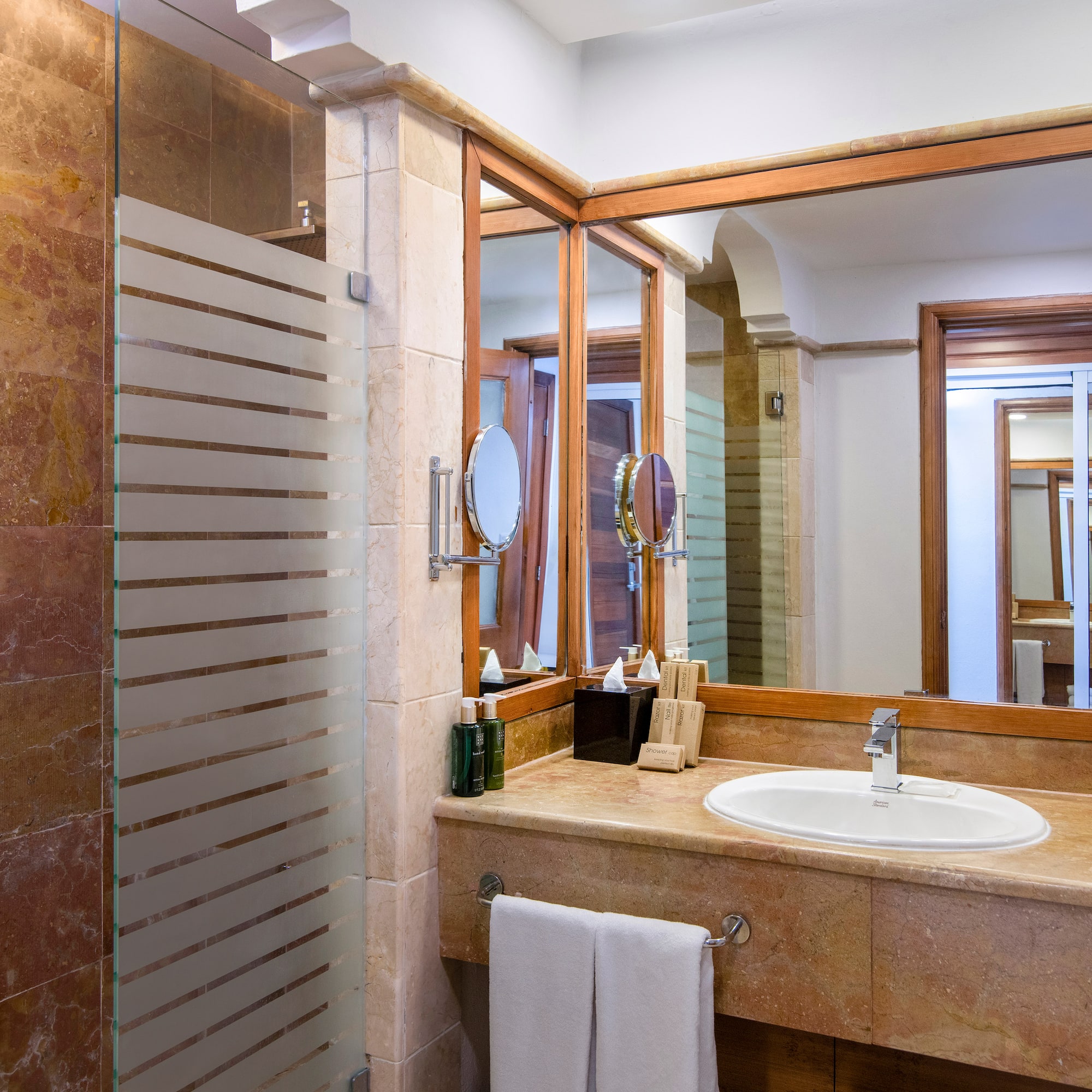 a bathroom with a mirror and sink