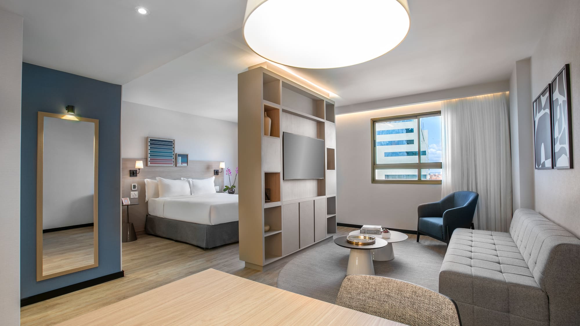 a room with a bed and a tv