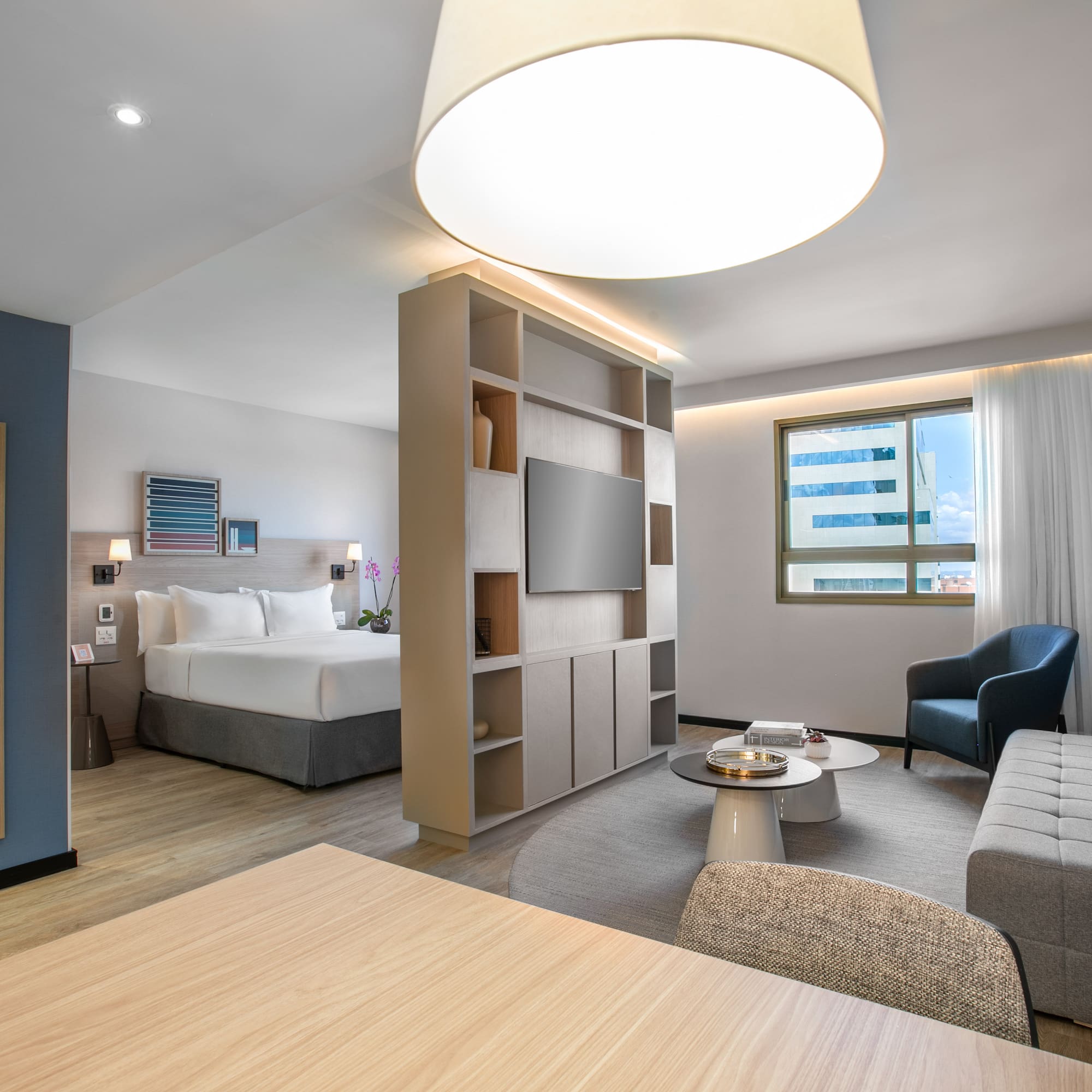 a room with a bed and a tv