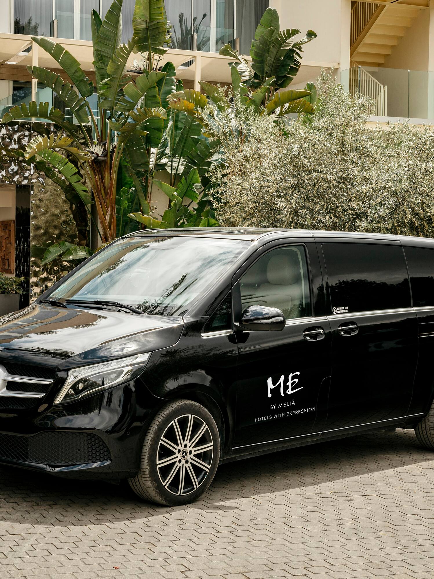 a black van parked in front of a building