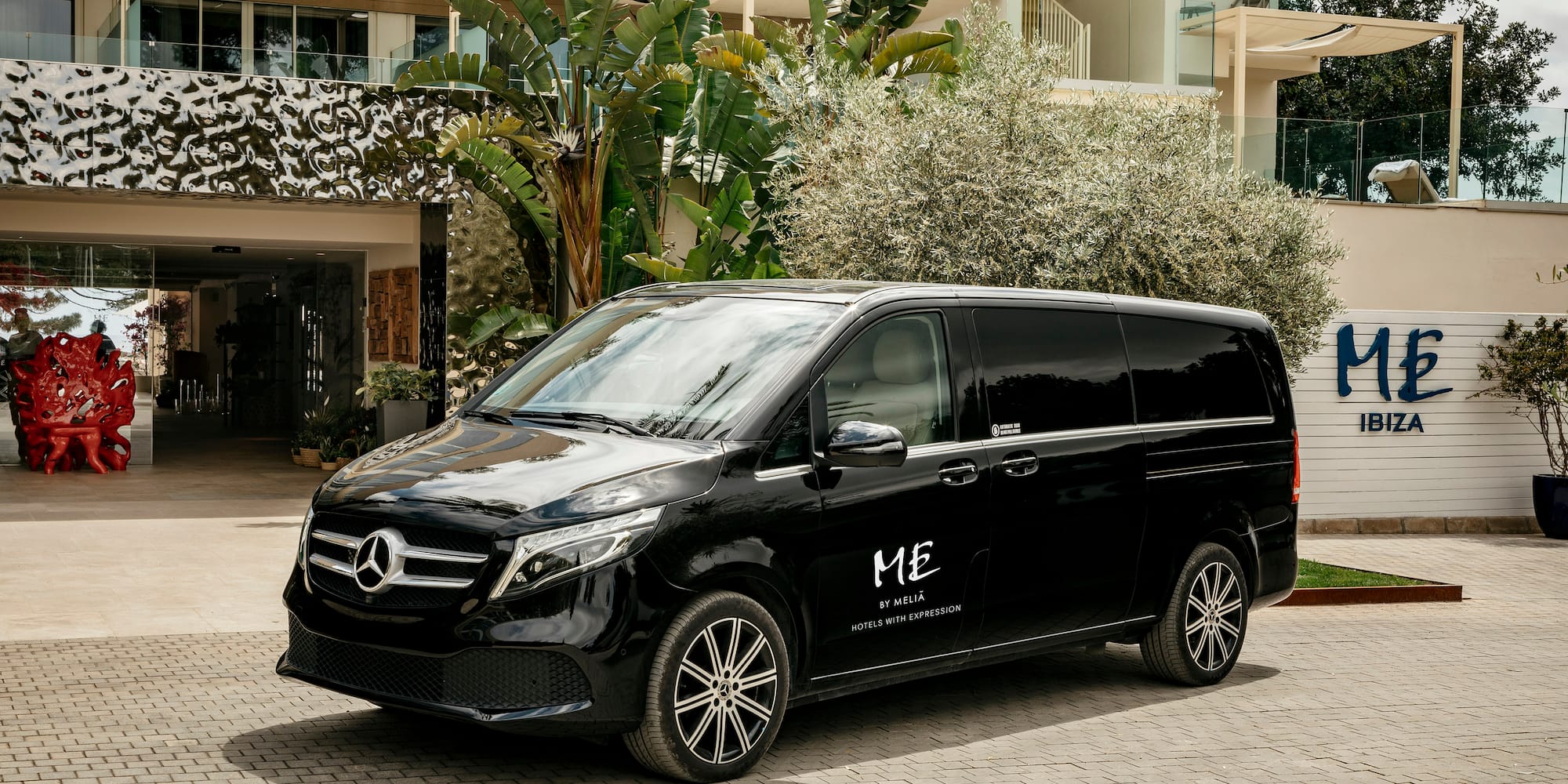 a black van parked in front of a building