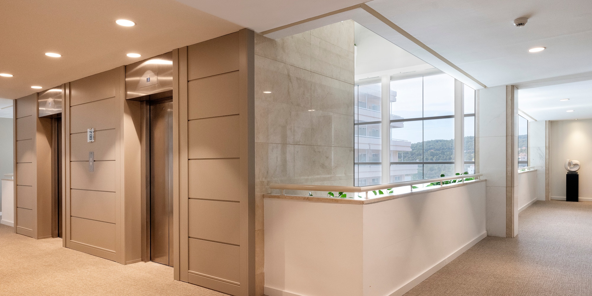 a lobby with a counter and elevator