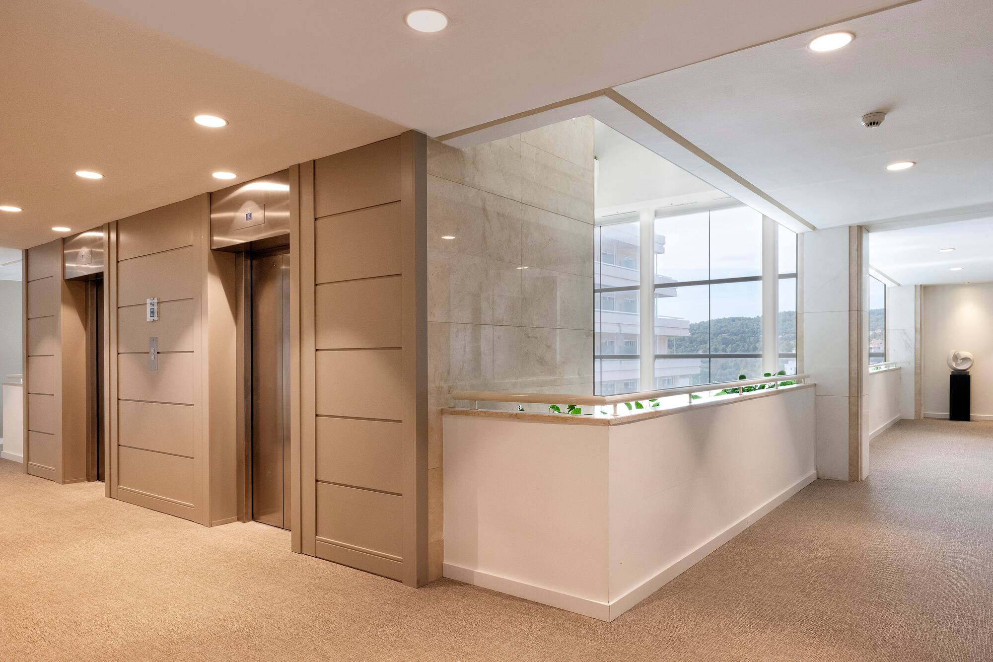 a lobby with a counter and elevator
