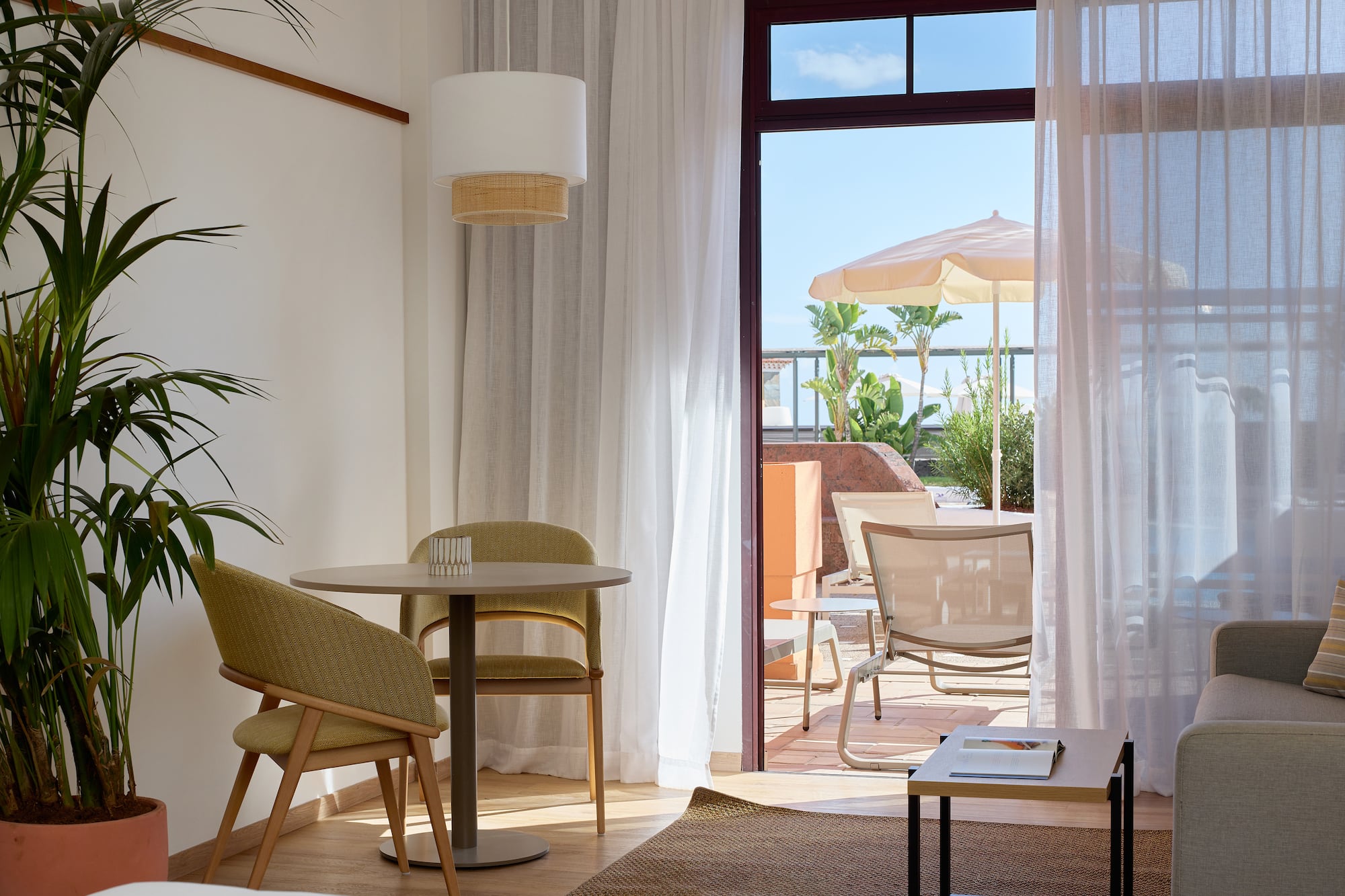 a room with a table and chairs and a table and chairs