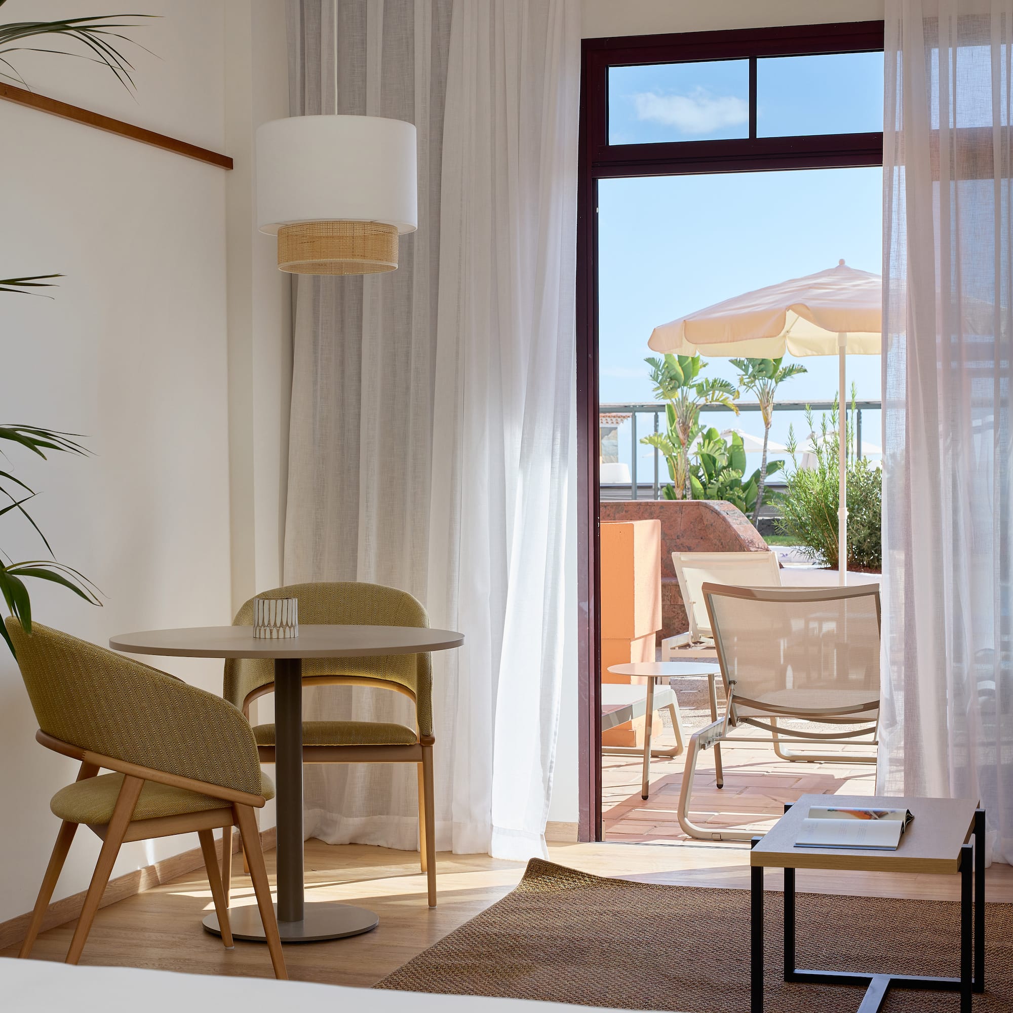 a room with a table and chairs and a table and chairs