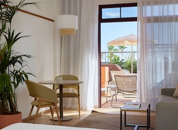 a room with a table and chairs and a table and chairs