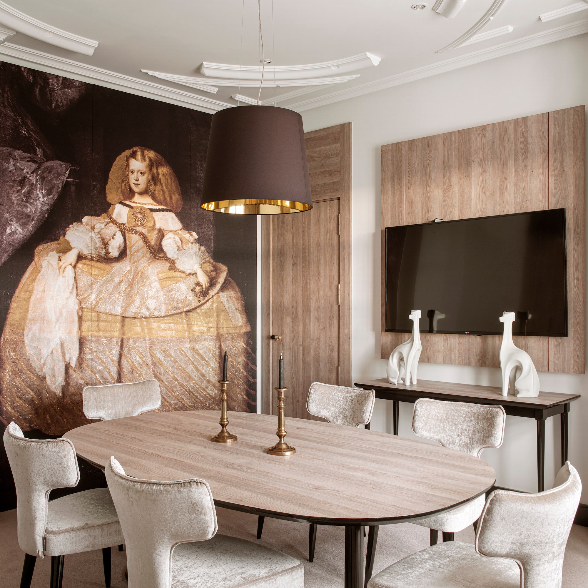 a room with a large painting on the wall