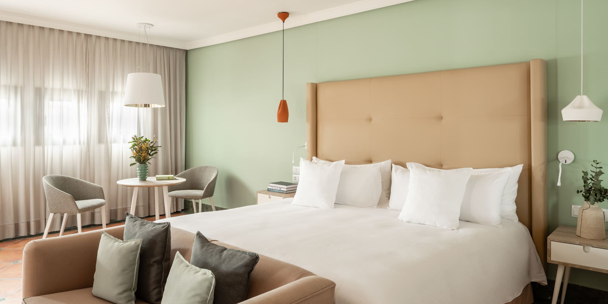 a bed with pillows in a room