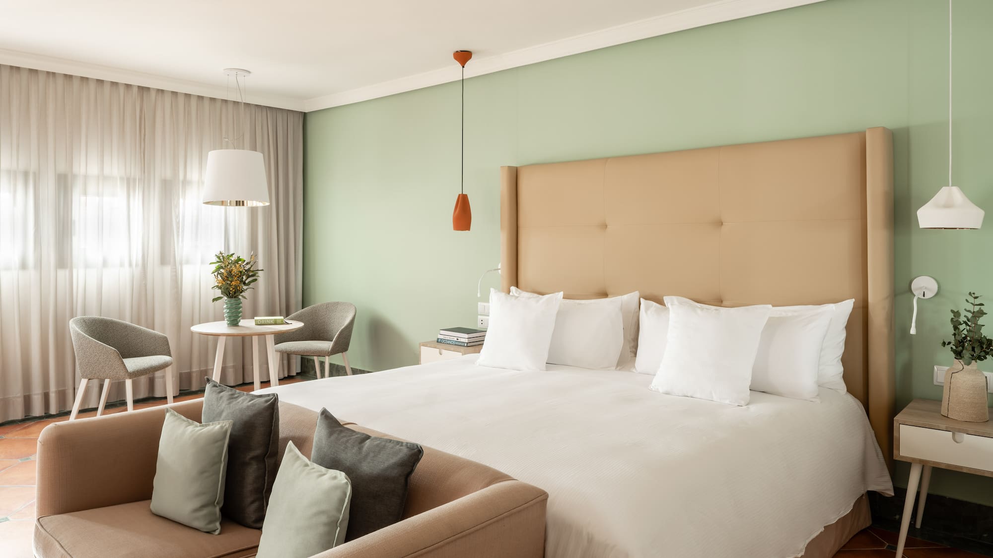 a bed with pillows in a room