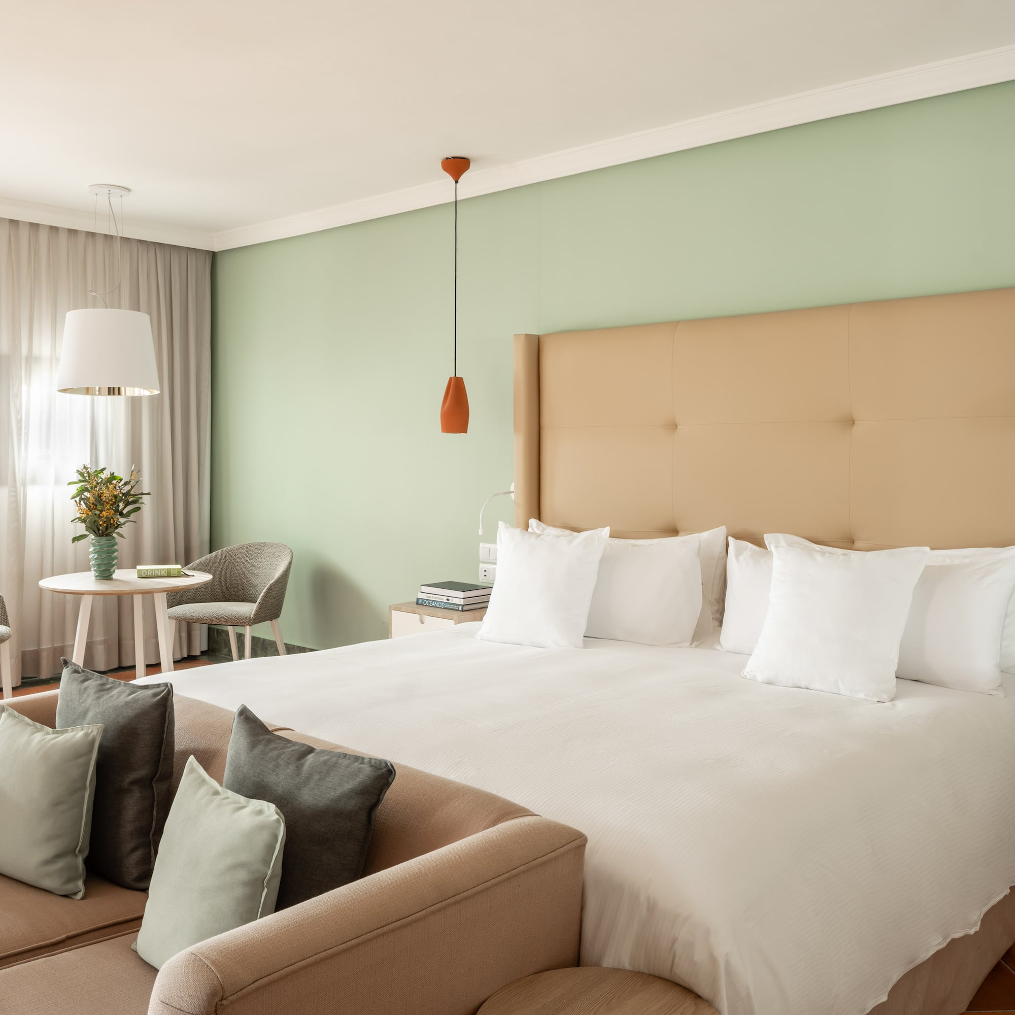 a bed with pillows in a room