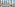 a room with tables and chairs and a view of a snowy mountain