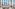 a room with tables and chairs and a view of a snowy mountain