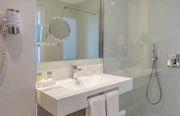 a bathroom with a shower and a sink