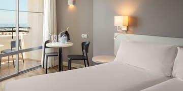 a room with a bed and table