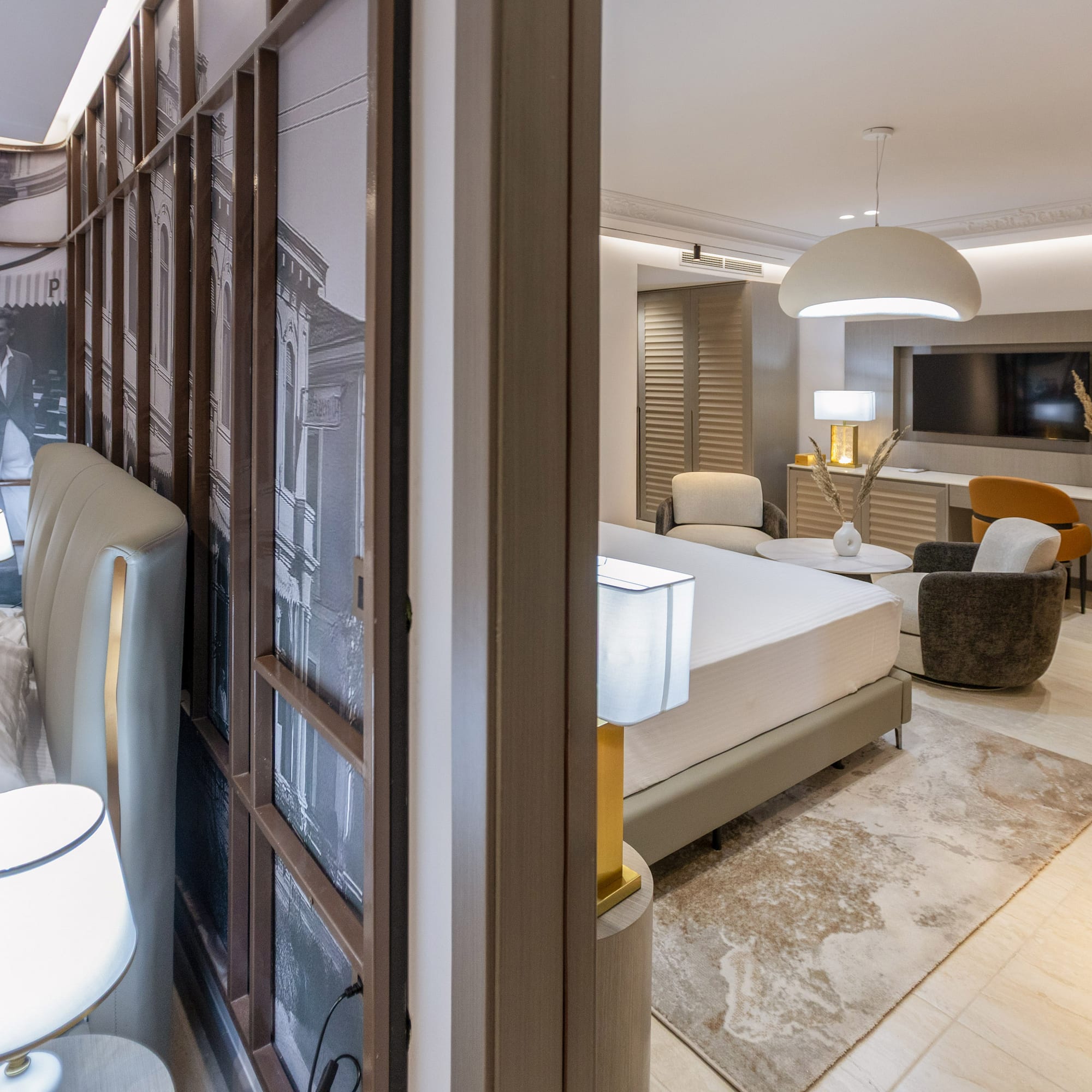 a room with a bed and a television