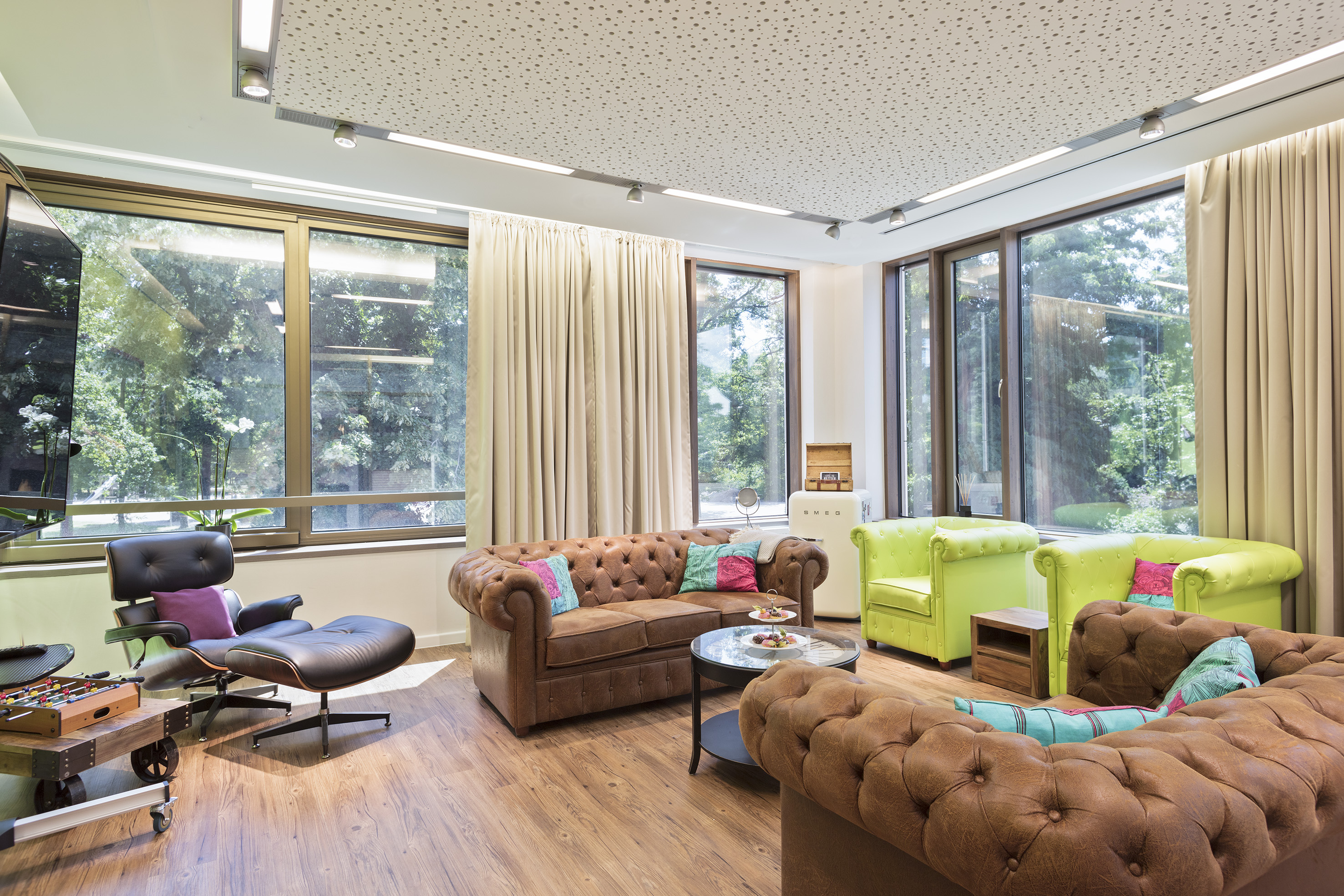 a room with couches and chairs