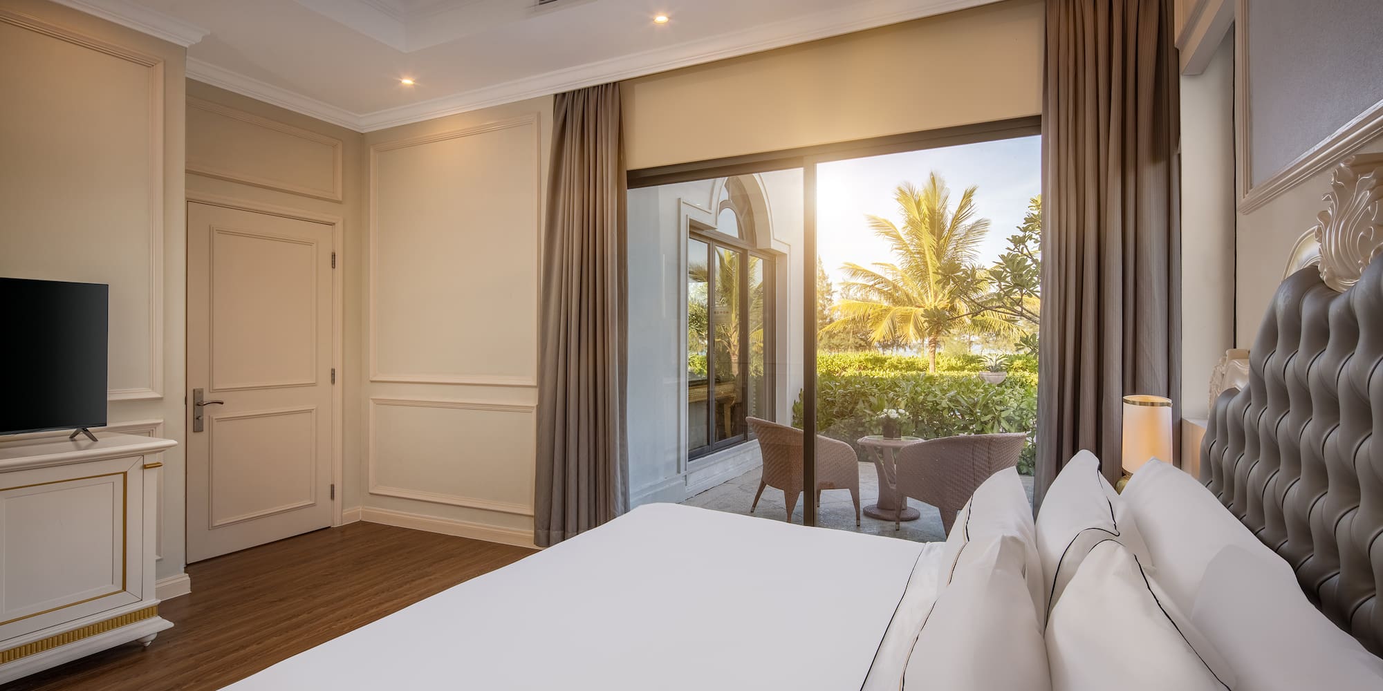 a bedroom with a large window