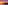 Vibrant sunset over beach with rows of umbrellas and lounge chairs.