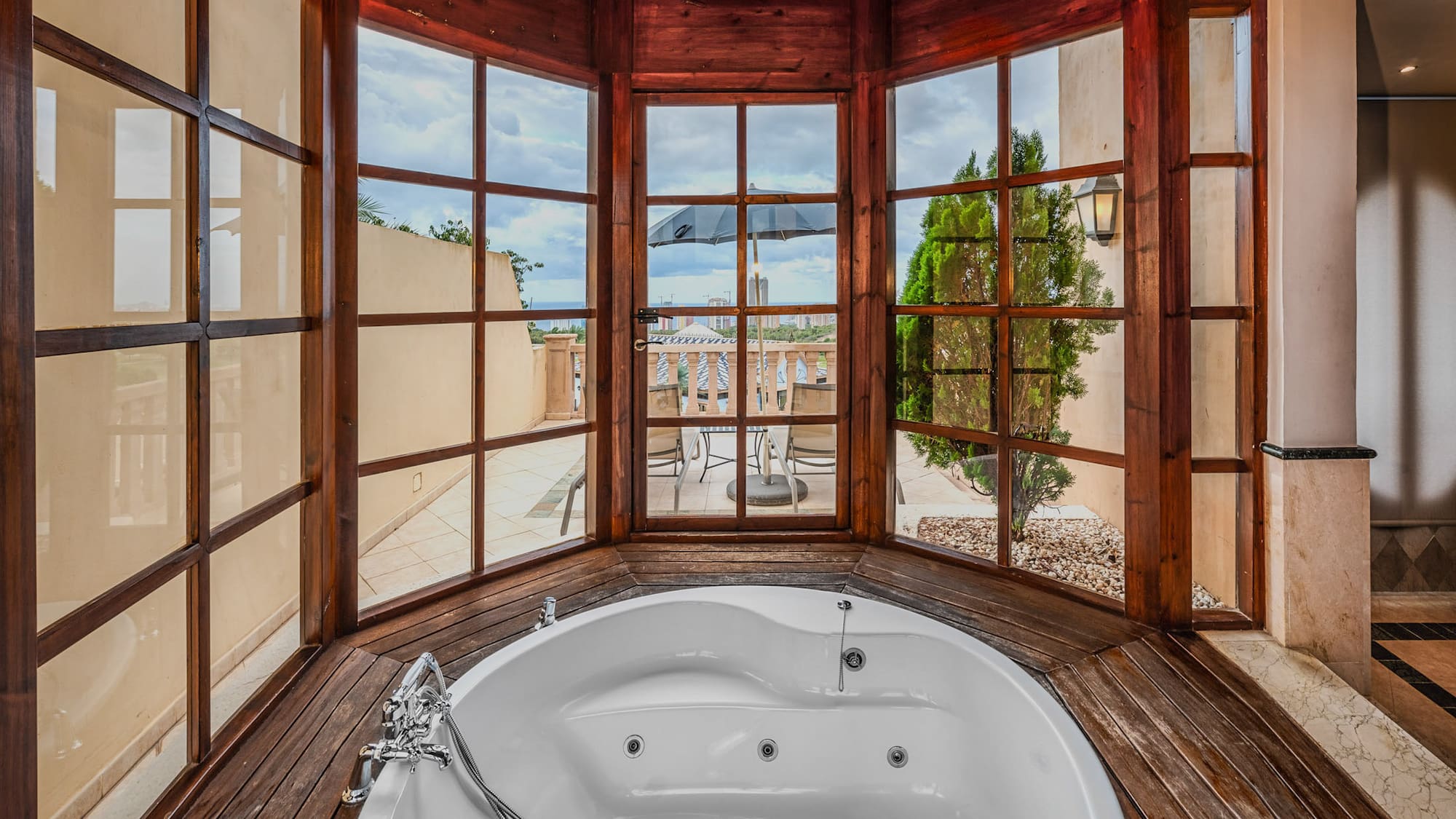 a large tub in a room with windows