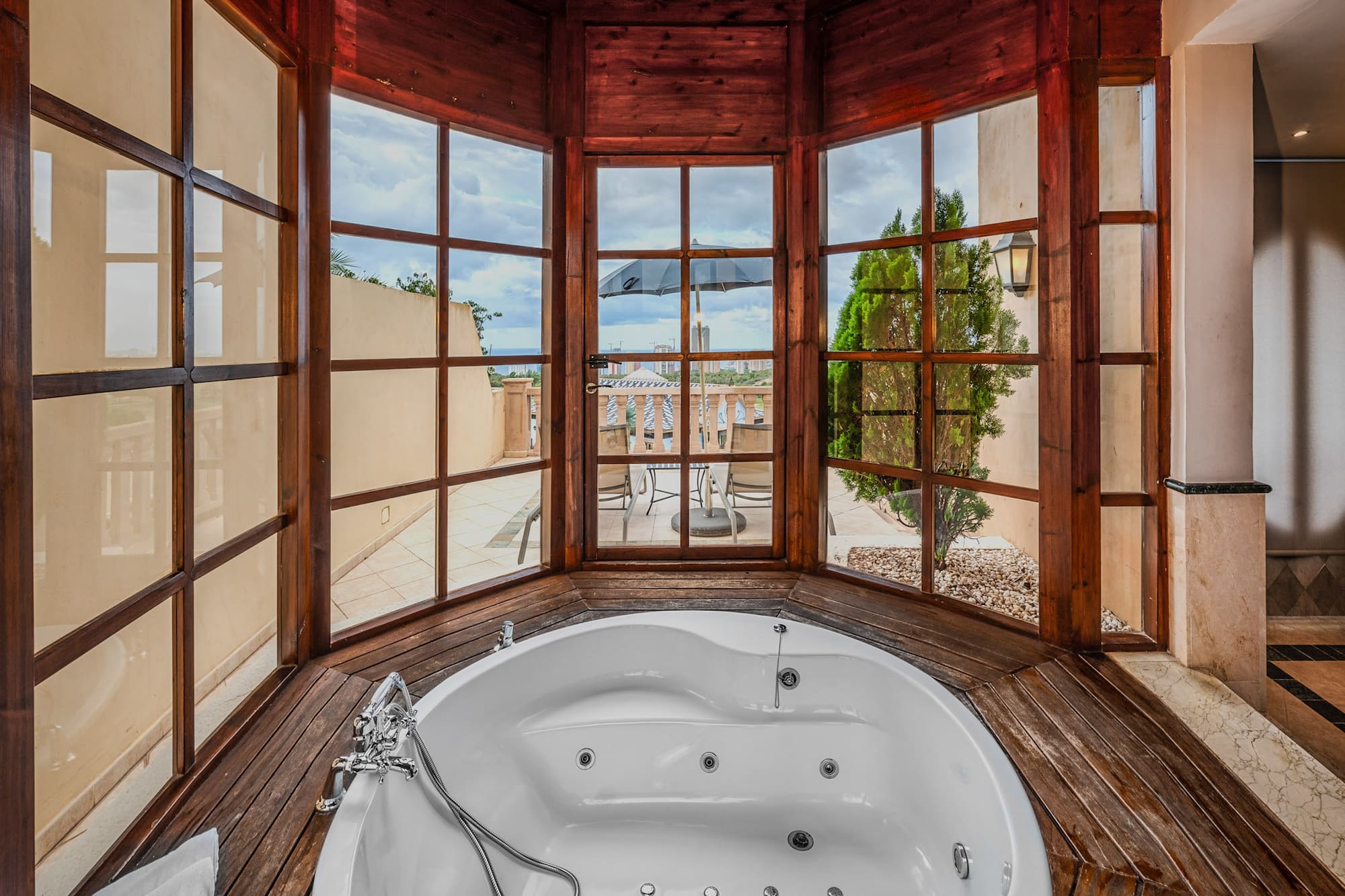 a large tub in a room with windows