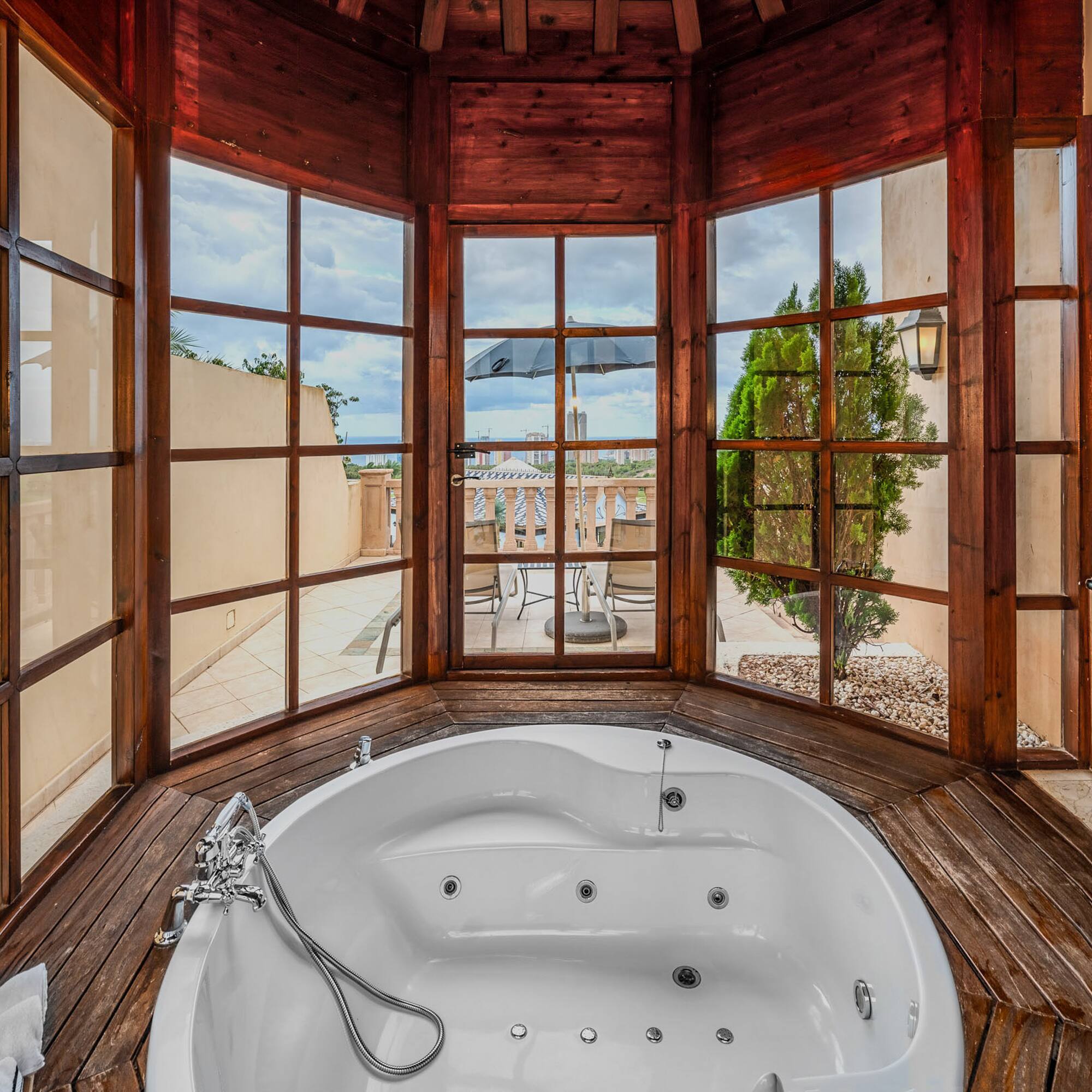 a large tub in a room with windows