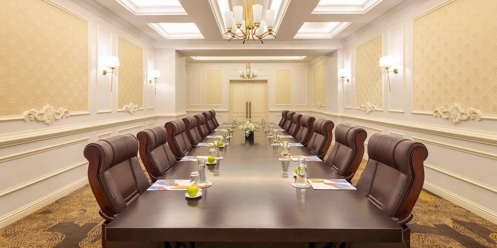 a conference room with a long table and chairs