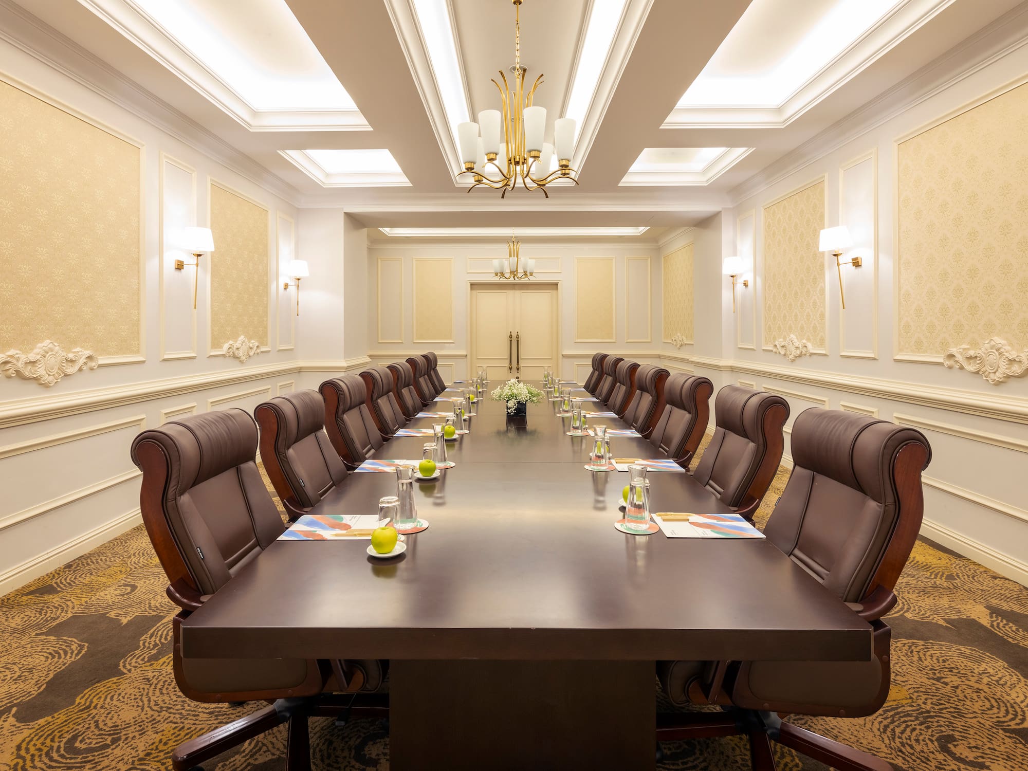 a conference room with a long table and chairs