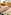 Deli buffet with cold cuts, assorted cheeses, and fresh baked bread rolls.