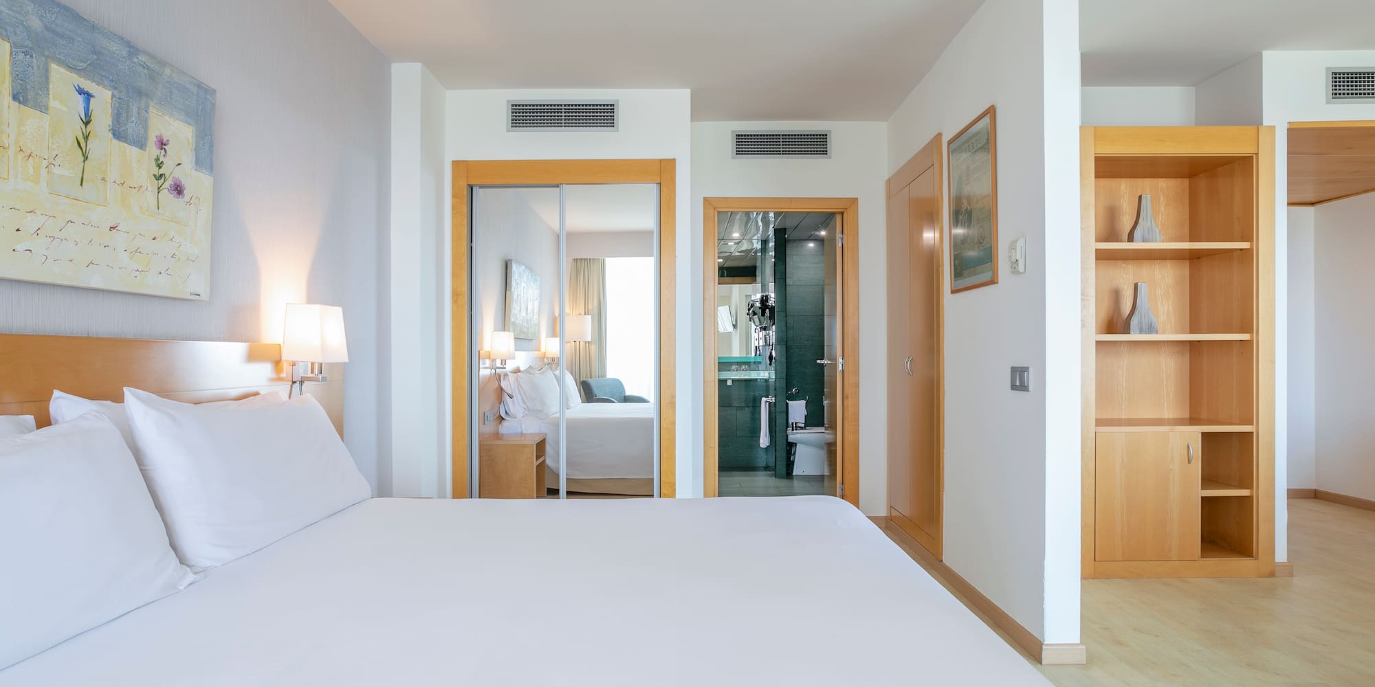 a bedroom with a bed and a closet