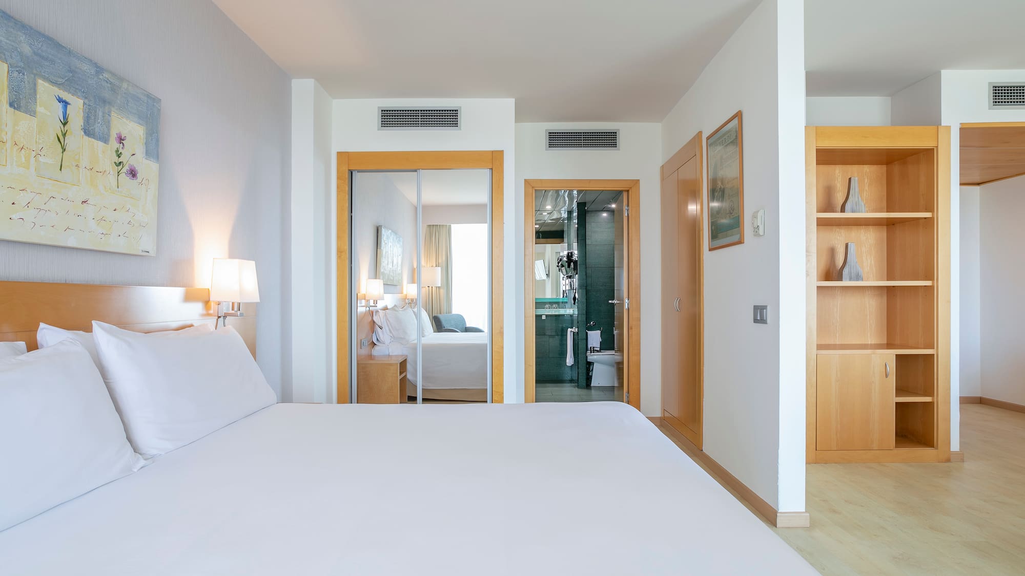 a bedroom with a bed and a closet