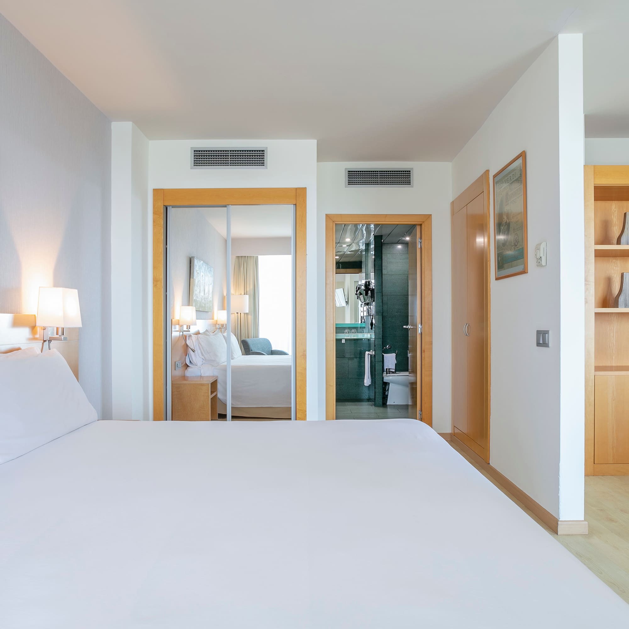 a bedroom with a bed and a closet