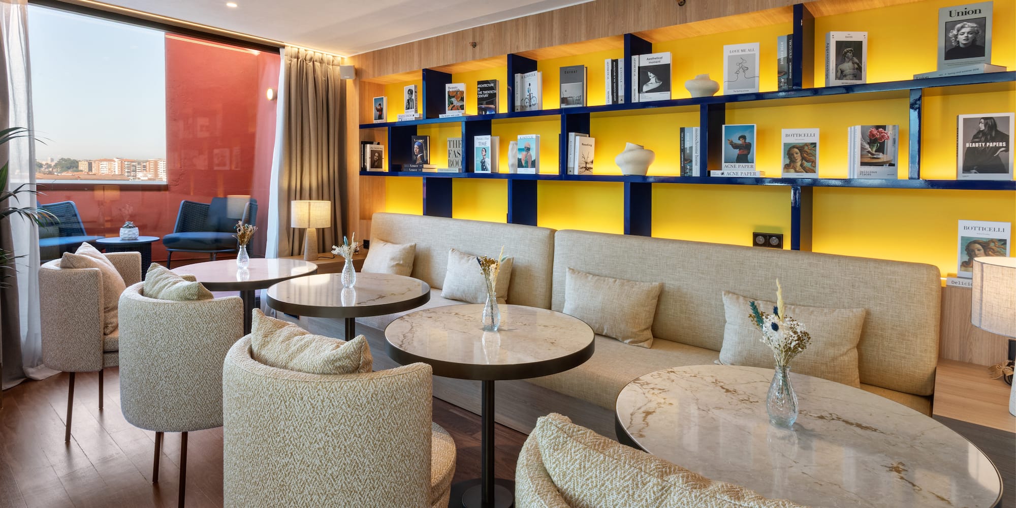 a room with a couch and tables