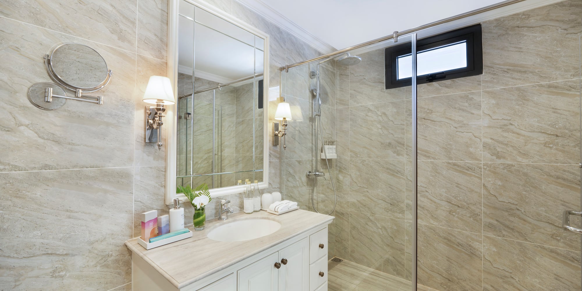 a bathroom with a shower and sink