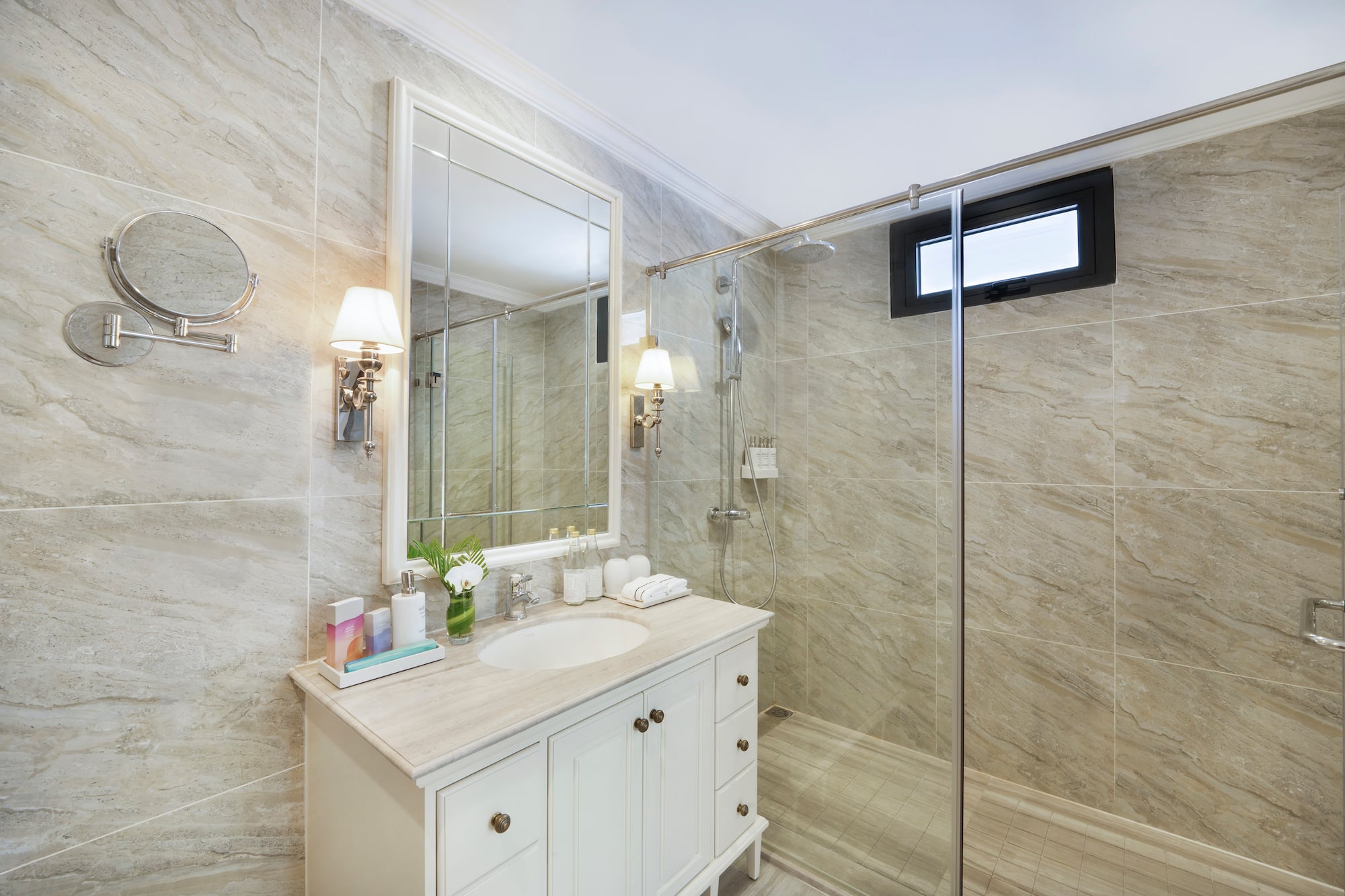 a bathroom with a shower and sink