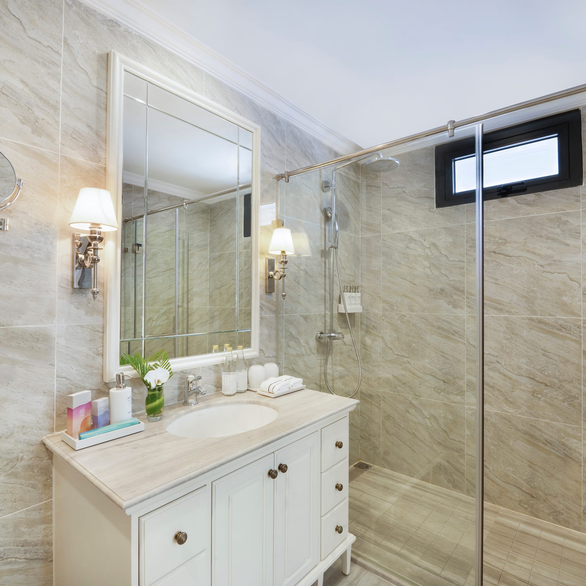 a bathroom with a shower and sink