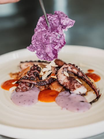 a plate of food with purple food on it