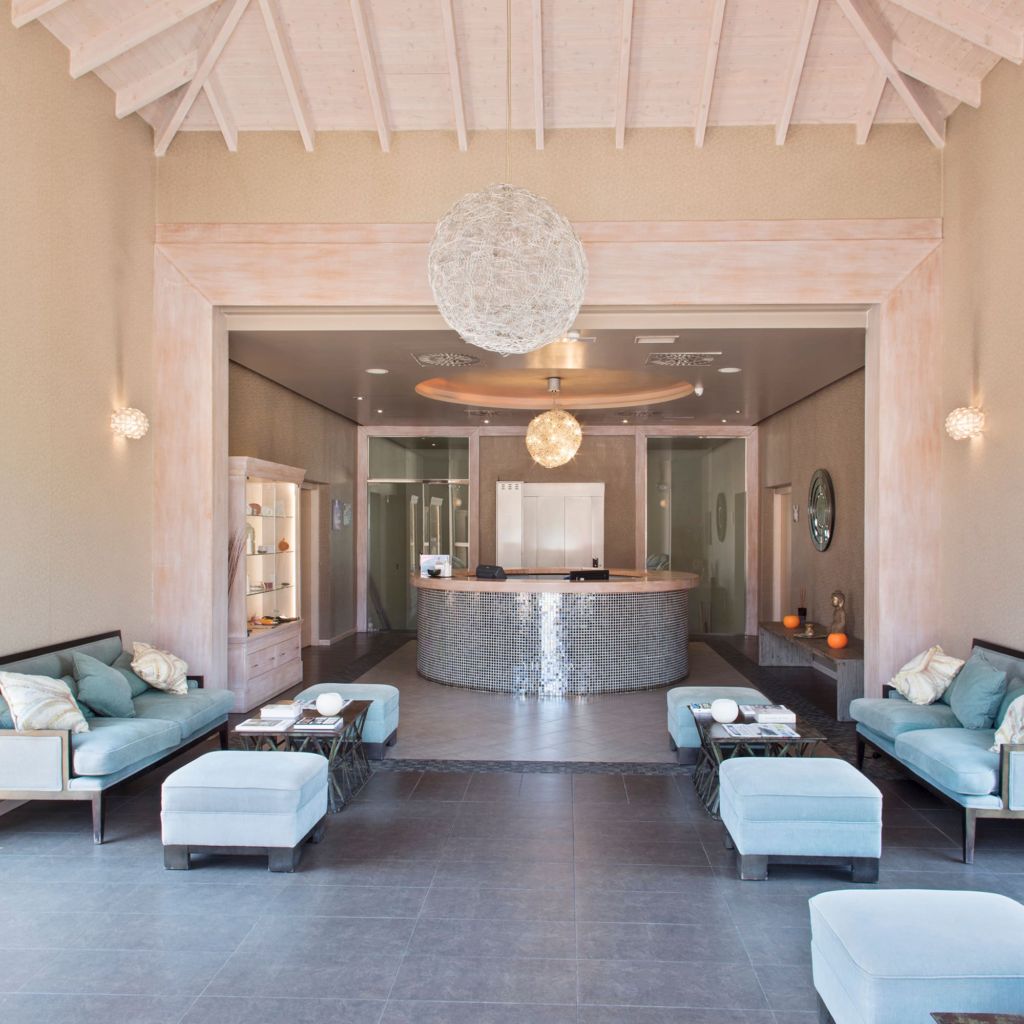 a room with a reception desk and couches