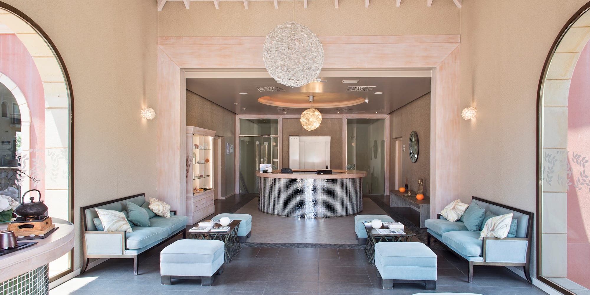 a room with a reception desk and couches