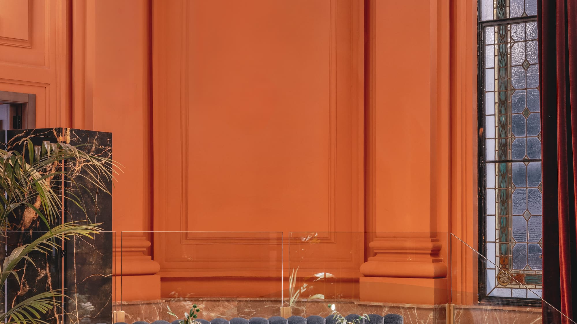 a chandelier above a couch in a room