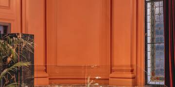 a chandelier above a couch in a room