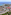 Aerial view of Mallorca beach resort with hotels, pools, and turquoise sea.