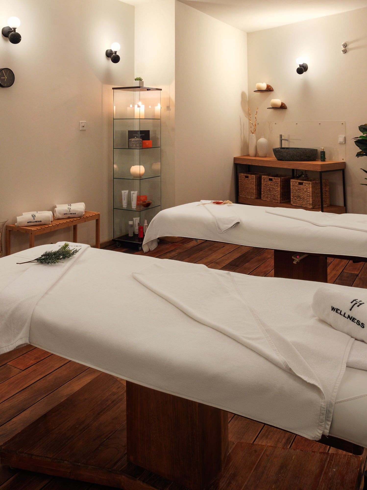 a room with white beds and towels