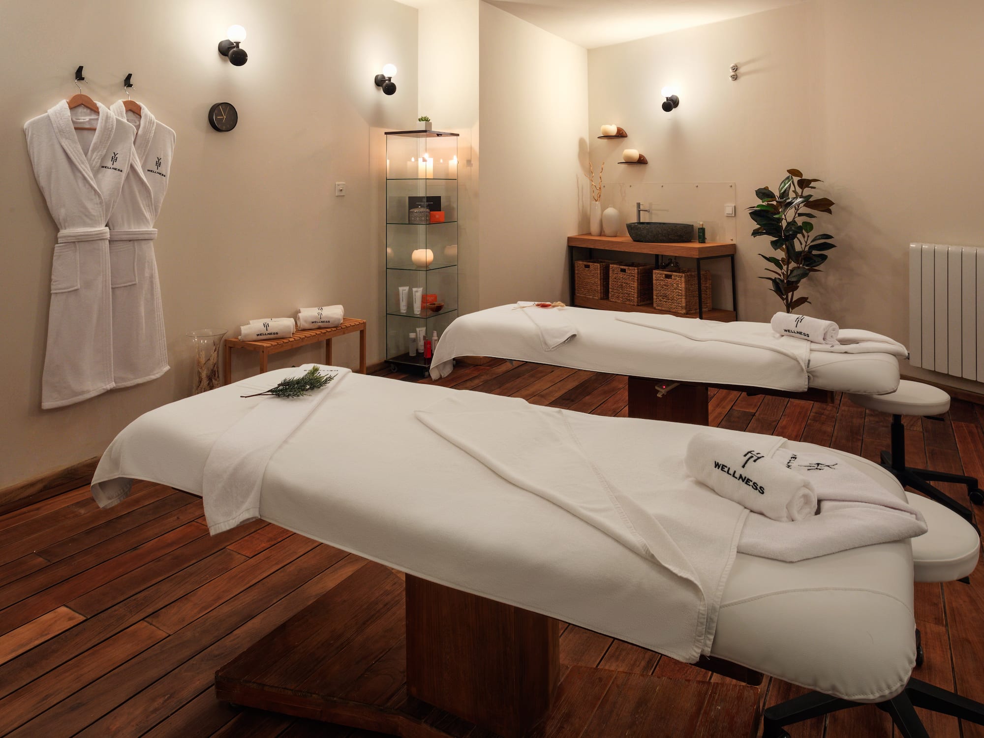 a massage table with towels and a cup of tea