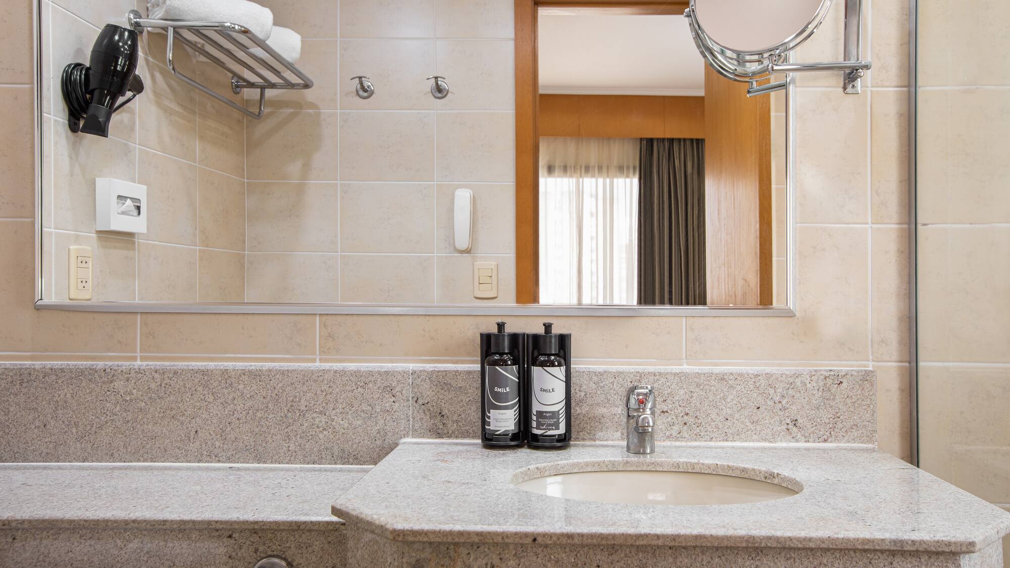 a bathroom with a mirror and a sink