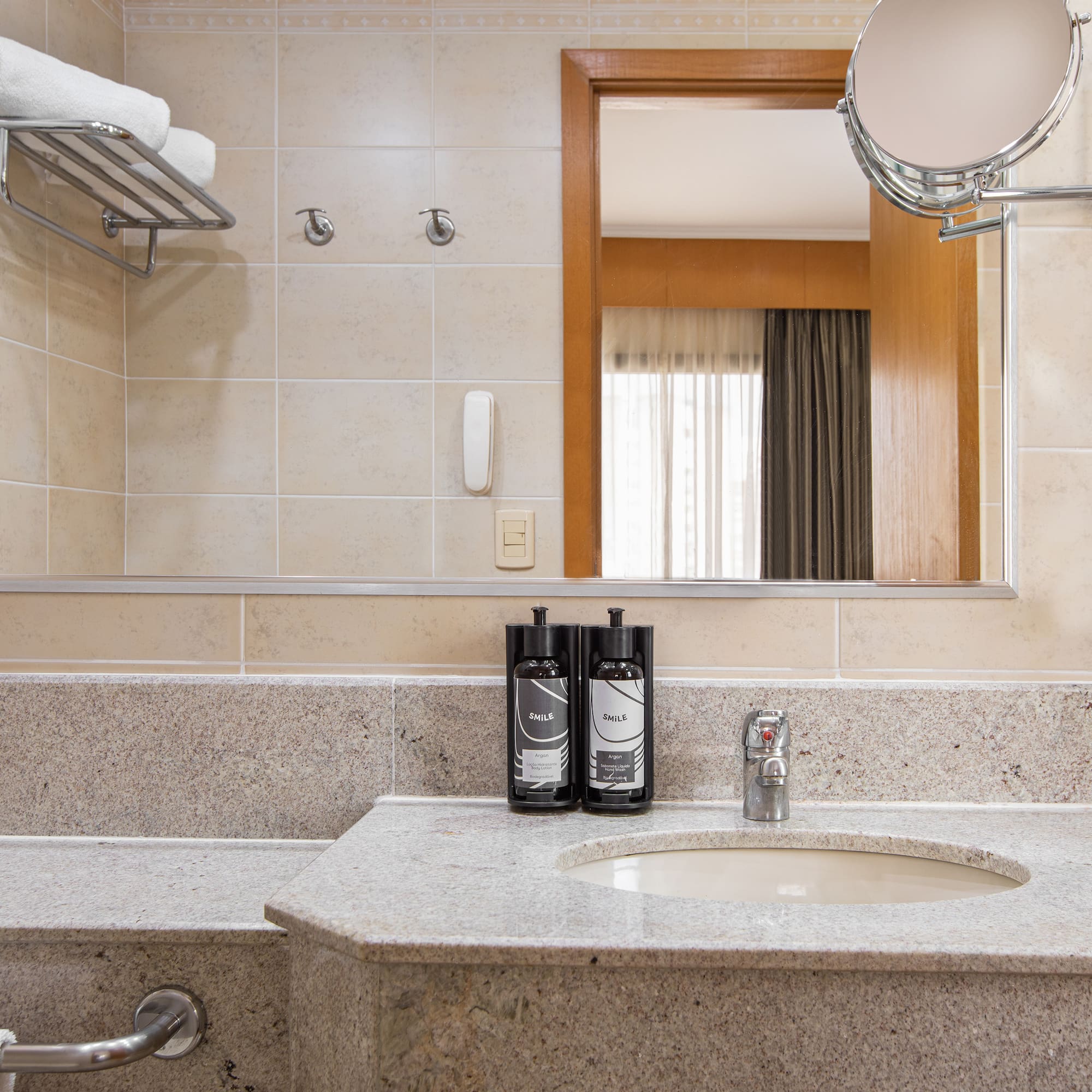 a bathroom with a mirror and a sink